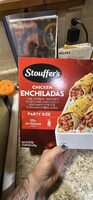 Mild chicken enchiladas shredded white meat chicken & vegetables wrapped in hand-rolled corn tortillas over rice & topped with real cheese & spicy cream sauce