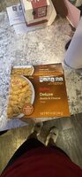 Deluxe enriched macaroni shells with creamy cheddar cheese sauce dinner