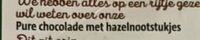 Pure chocolade met hazelnootstukjes