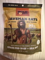 Caveman eats air-dried beef slices