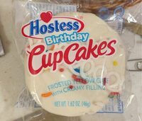 Frosted yellow cake with creamy filling birthday cupcakes