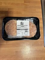 Hamburguesa de pollo rulo de cabra con cebolla caramelizada
