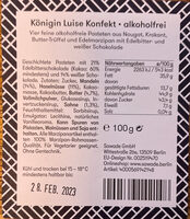 Geschichtete Pasteten mit 21% Edelbitterschokolade (Kakao: 60% mindestens) und 14% weißer Schokolade.