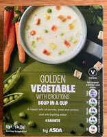 Soup in a cup golden vegetable with croutons
