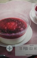 Panna cota cream and raspberry coulis