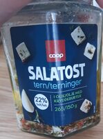 Salatost terninger i olje med krydderurter
