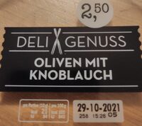 Grüne entsteine Oliven mit Knoblauch