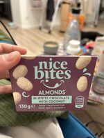 Nice bites almonds in white chocolate with coconut