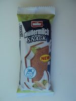 Muller Baton pufos cu umplutura de nuca de cocos si fistic